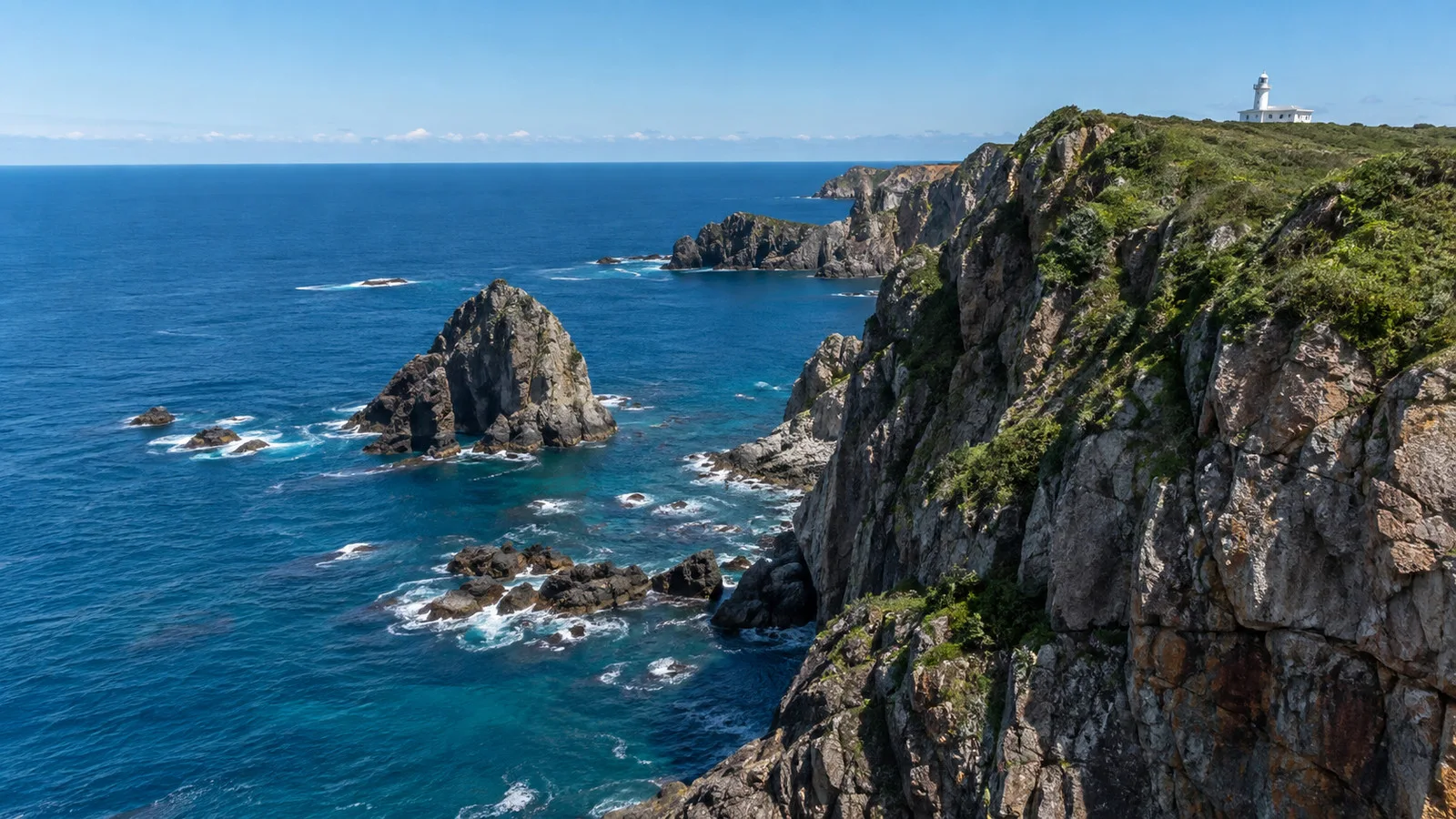 Rocky cliffs and blue sea near Cape Chikyu