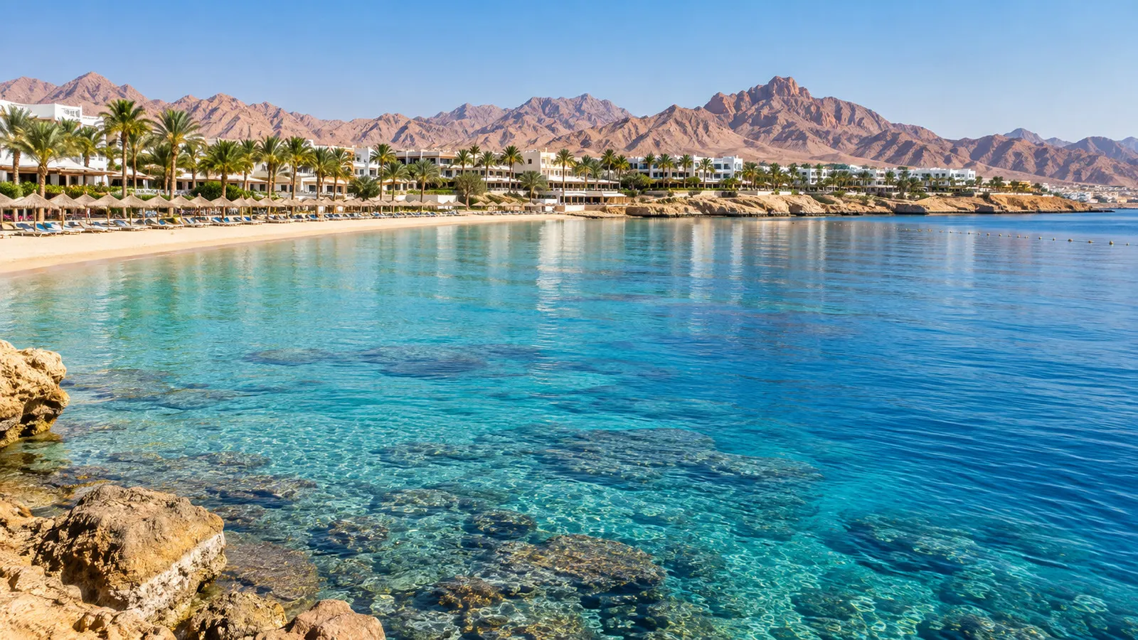 Sandy beach and clear Red Sea shoreline at Naama Bay