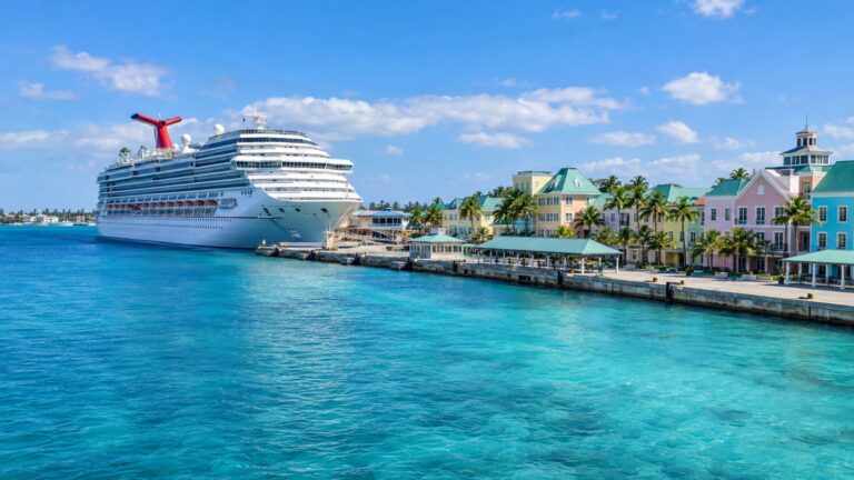 Cruise ship beside Nassau's colorful waterfront and turquoise harbor
