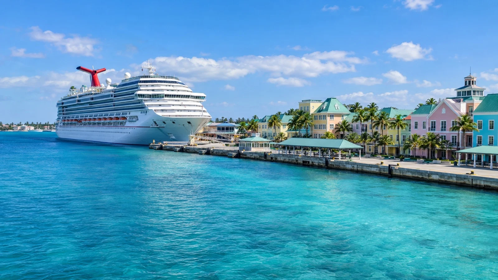 Cruise ship beside Nassau's colorful waterfront and turquoise harbor