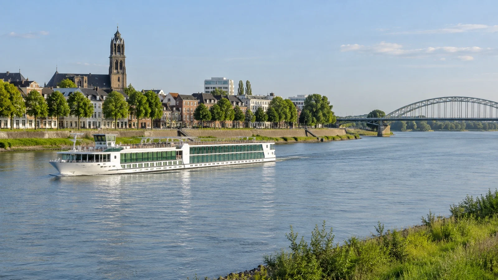 River cruise ship on the Rhine at Arnhem with a Dutch riverside city backdrop