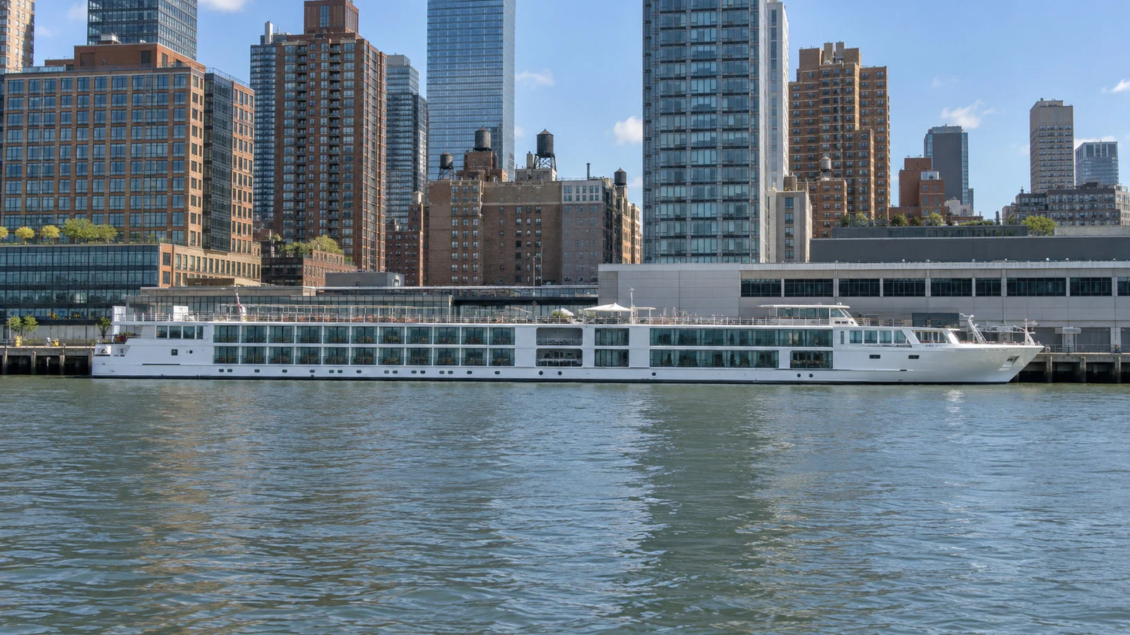 Small river cruise ship moored at a Manhattan pier on the Hudson River