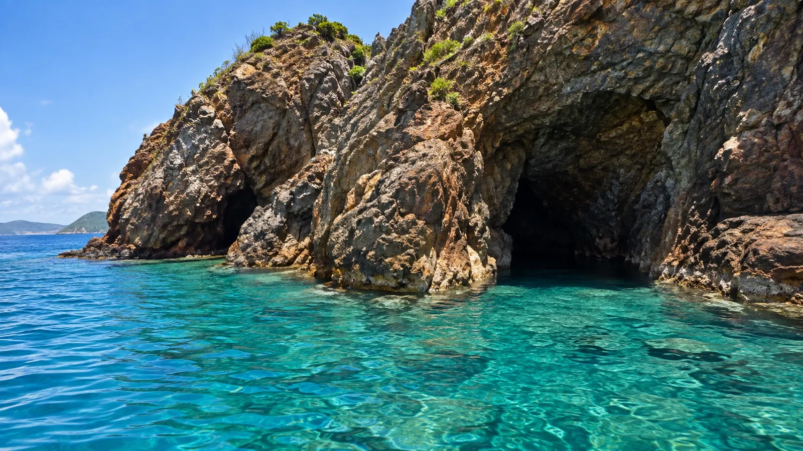 Rocky sea caves and clear turquoise water on Norman Island, British Virgin Islands