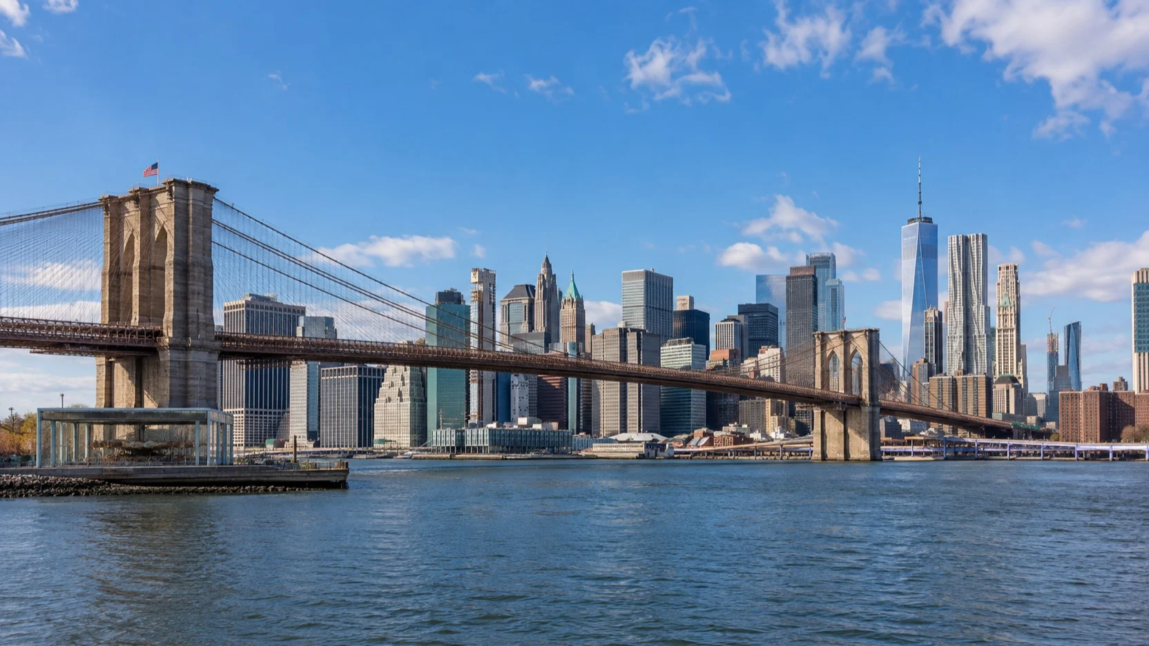 Brooklyn Bridge crossing the East River toward the Lower Manhattan skyline