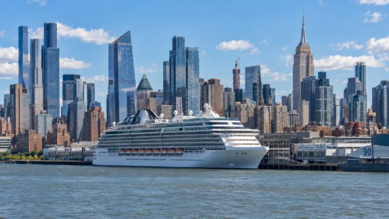 Cruise ship docked at the Manhattan Cruise Terminal on the Hudson River with Midtown behind