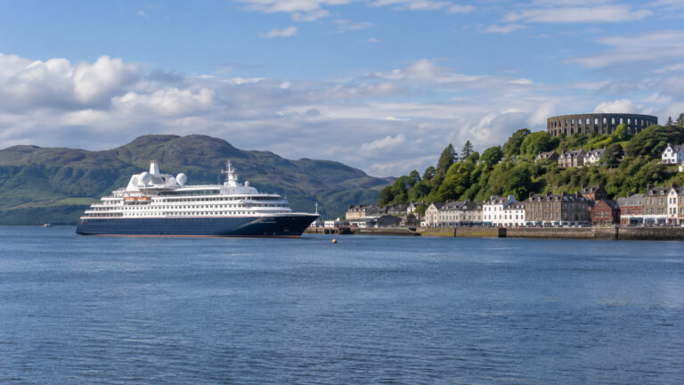 Small cruise ship anchored off Oban harbor in Scotland