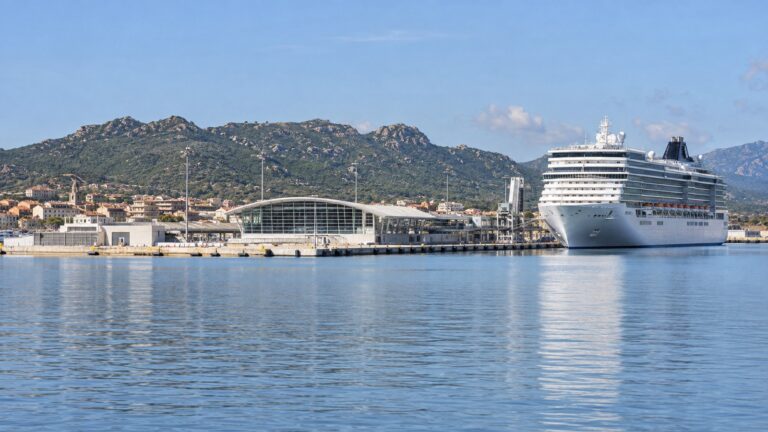 Cruise ship at Olbia Isola Bianca port with Sardinian hills beyond