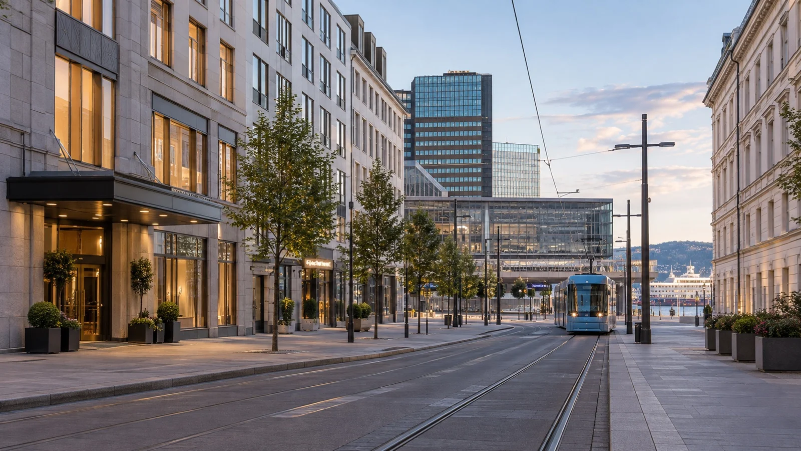 Central Oslo street near Oslo S with practical Scandinavian hotel facades and quiet tram lines