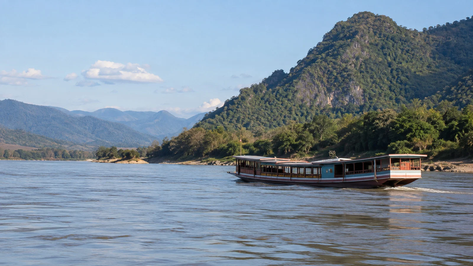 Passenger boat traveling on the Mekong River in Laos