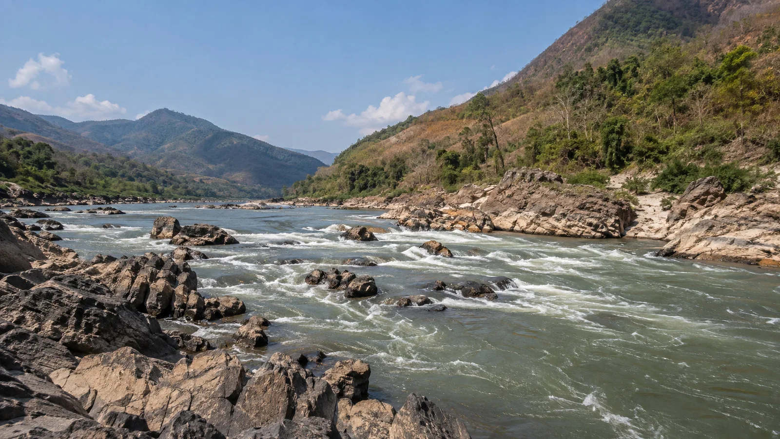 Rocky Mekong River rapids and hills near Pak Lay, Laos