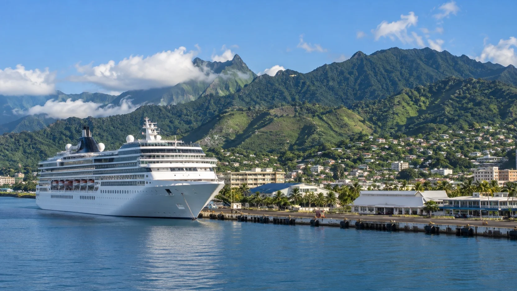 Cruise ship at Papeete quay beneath Tahiti’s green hills