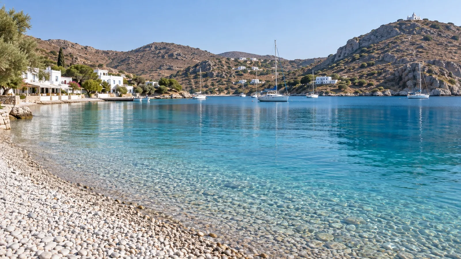 Clear water and pebble beach at Grikos Bay on Patmos