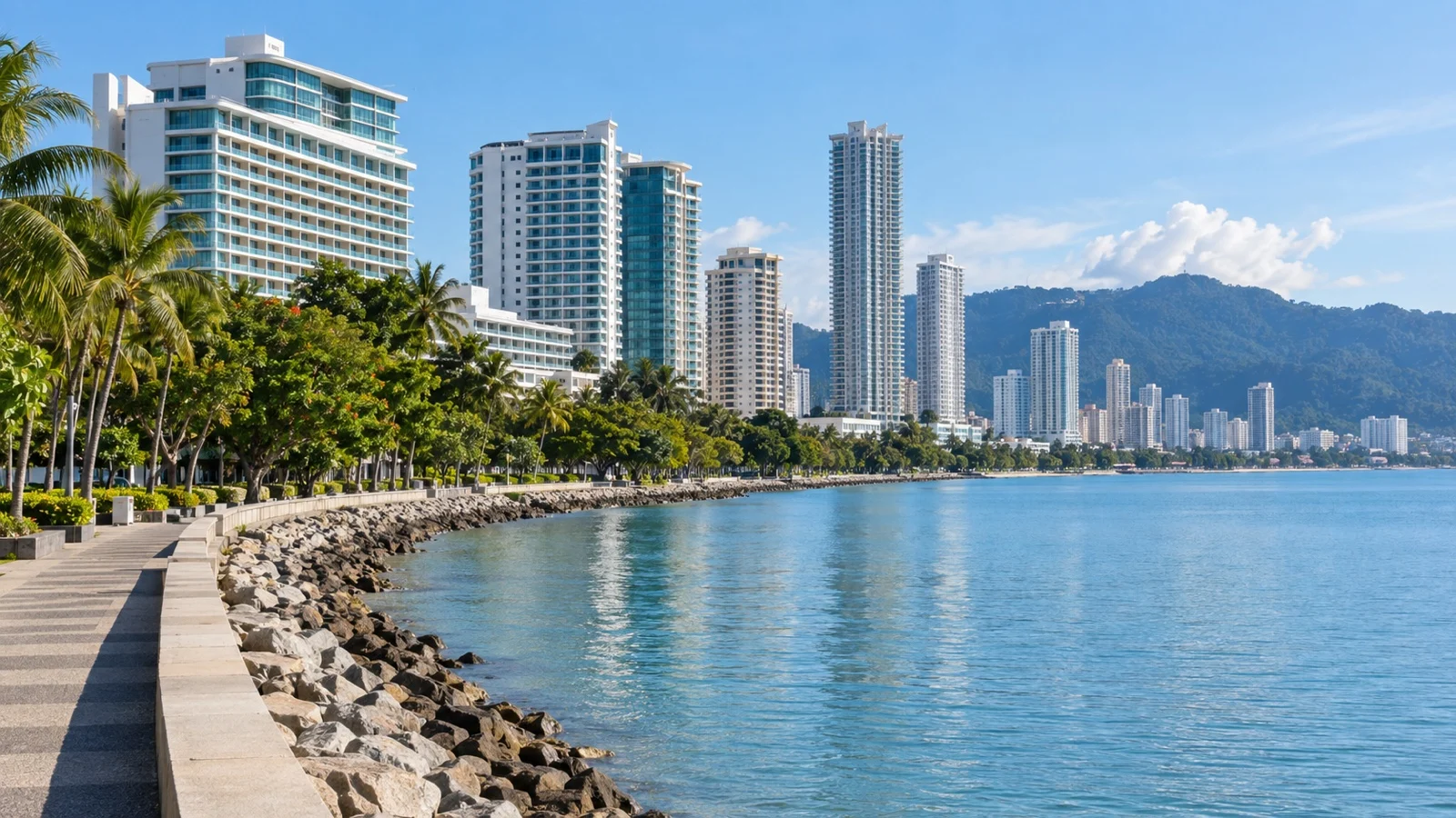 Modern waterfront hotels and promenade along Gurney Drive in Penang