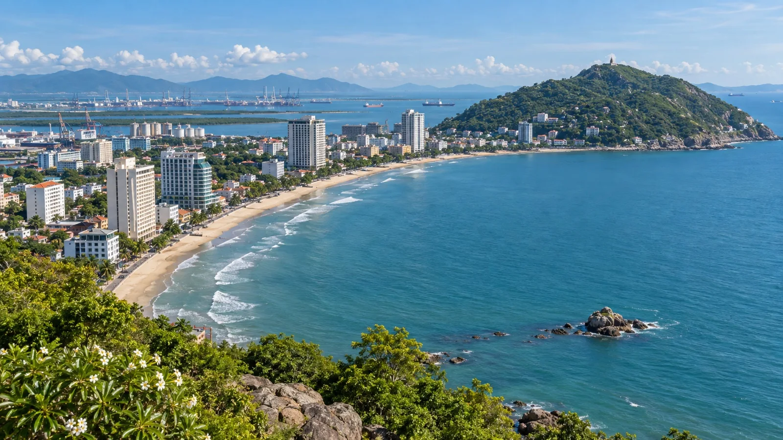 Panoramic Vũng Tàu coast with beachfront hotels, green hills and blue sea