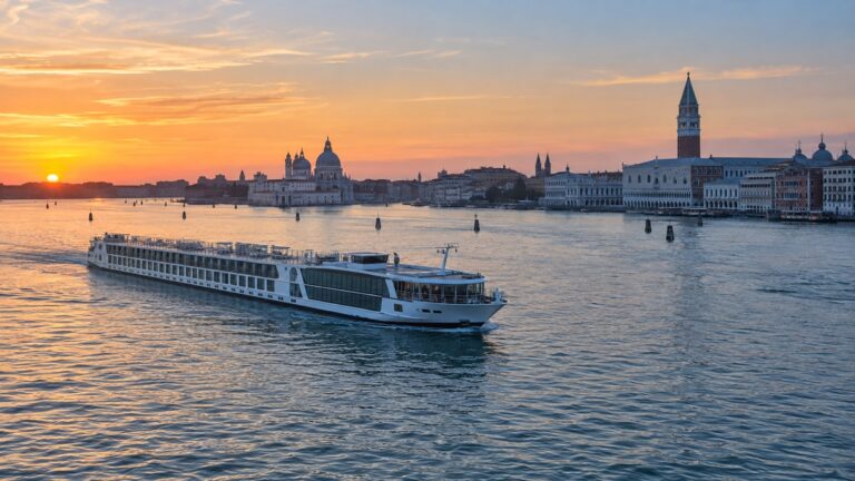 Small river cruise ship crossing the Venice lagoon near the historic waterfront