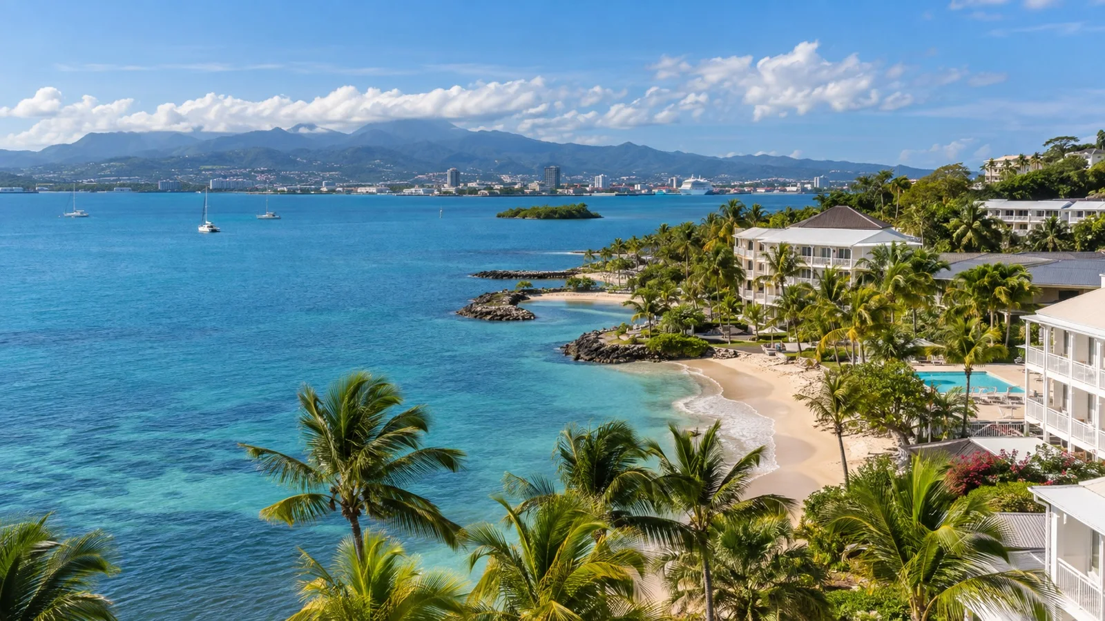 Le Gosier coast near Pointe-à-Pitre with seaside hotels, palms and views across the bay