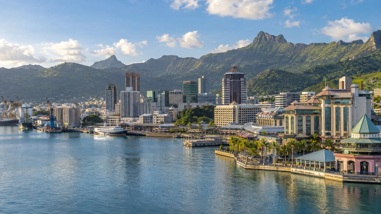 Panoramic Port Louis and Caudan Waterfront showing harbor, hotel buildings and mountains
