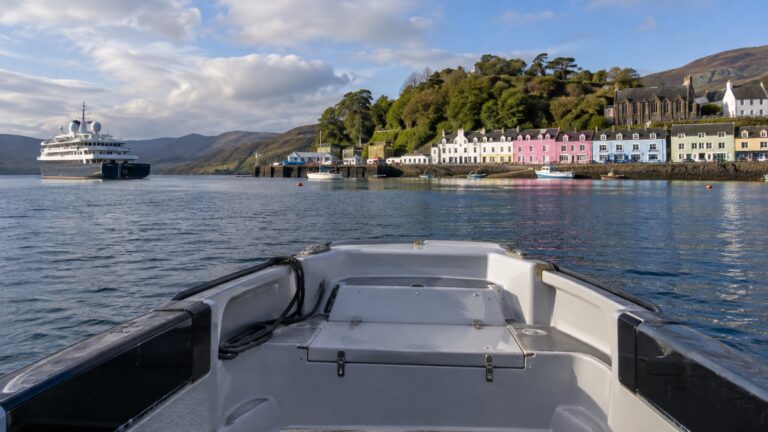 Cruise tender crossing Portree harbor on Isle of Skye