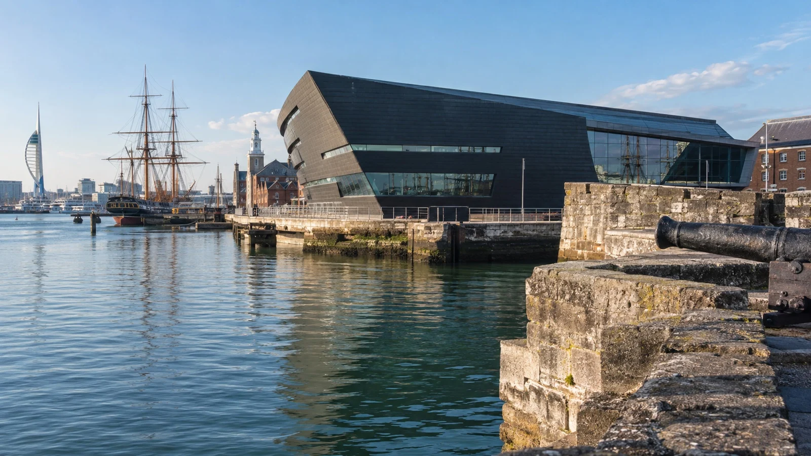 Modern maritime museum building beside Portsmouth harbor