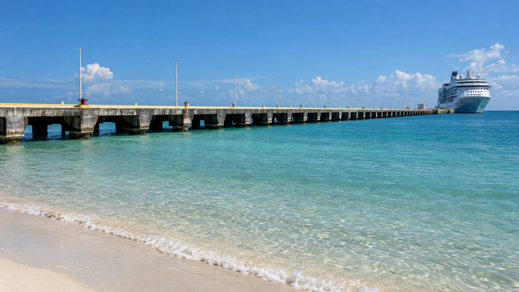Long Progreso cruise pier extending across shallow Gulf water