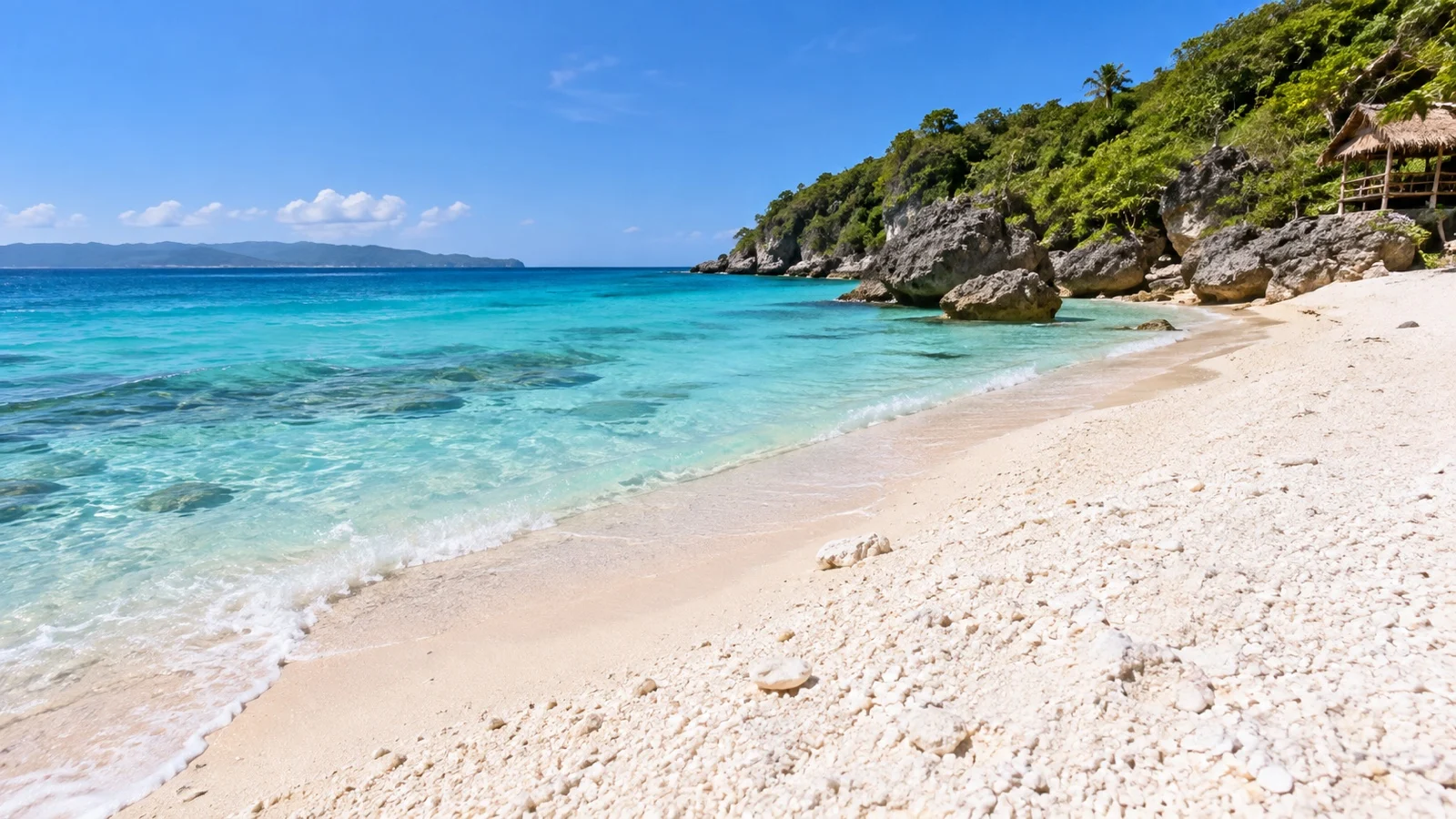 Puka Beach and green northern headland on Boracay