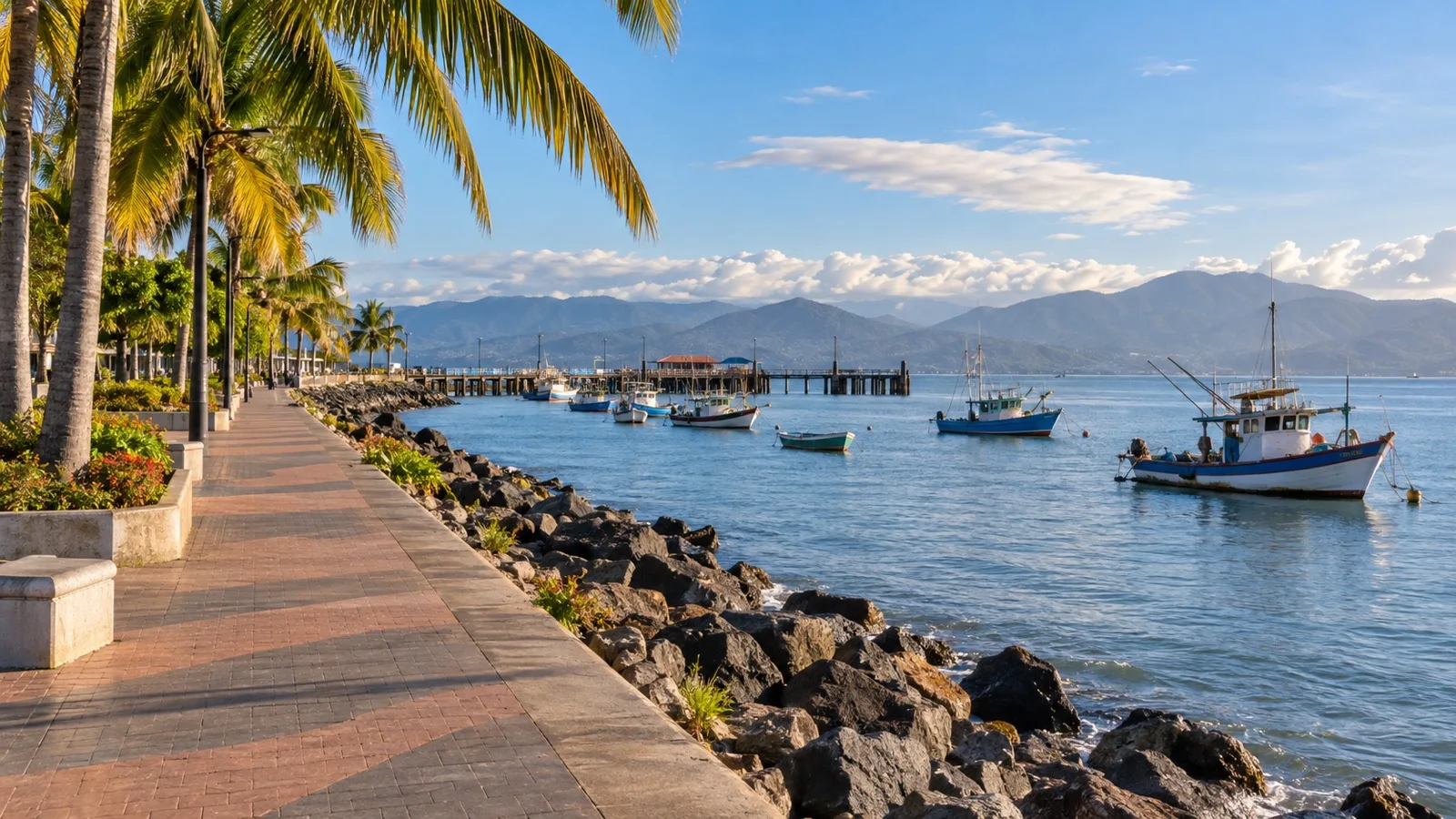 Palm-lined waterfront promenade beside the Gulf of Nicoya in Puntarenas