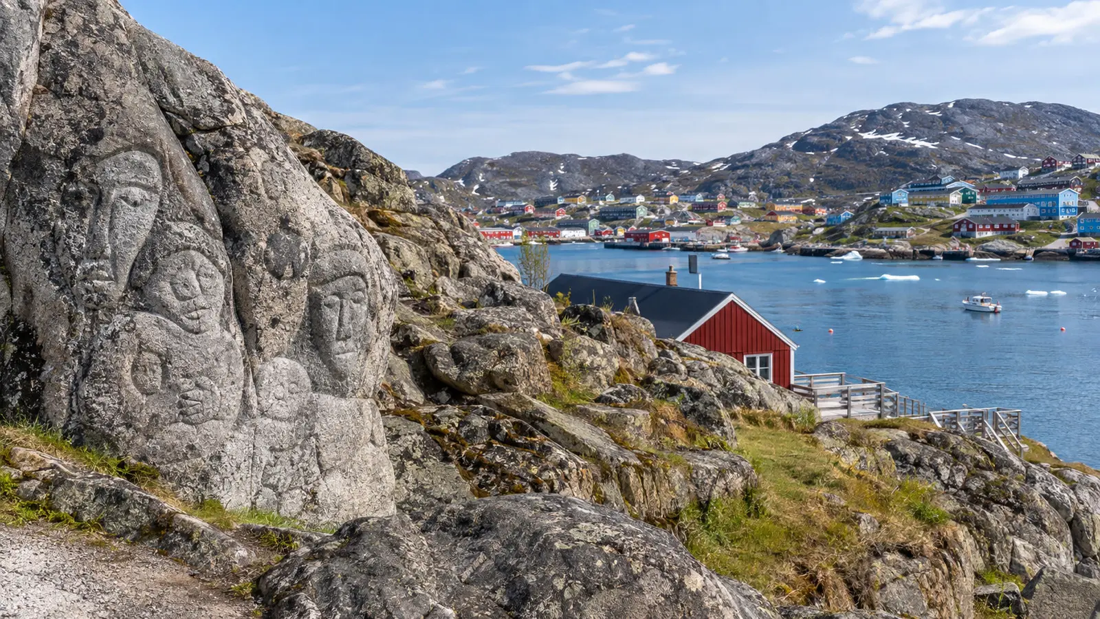 Stone and Man carved rock artwork on Qaqortoq waterfront