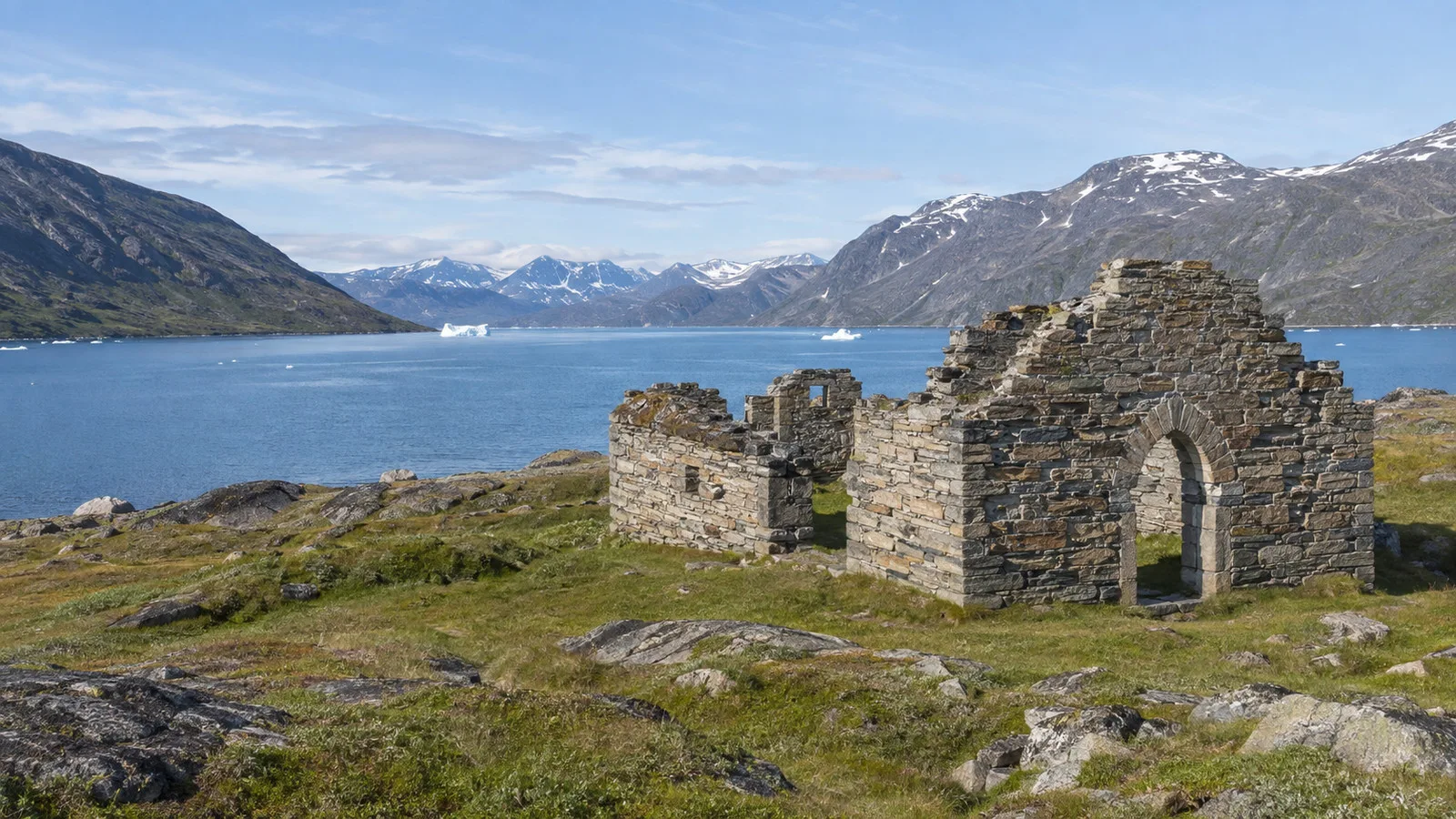Stone ruins of Hvalsey Church beside a Greenland fjord
