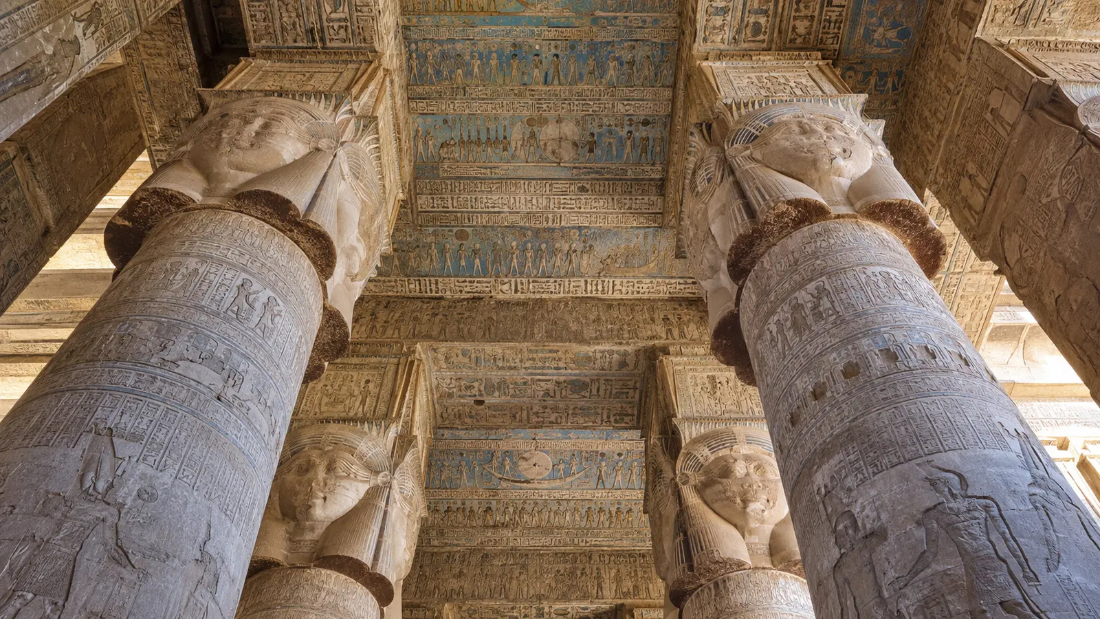 Carved columns and painted ceiling at Dendera