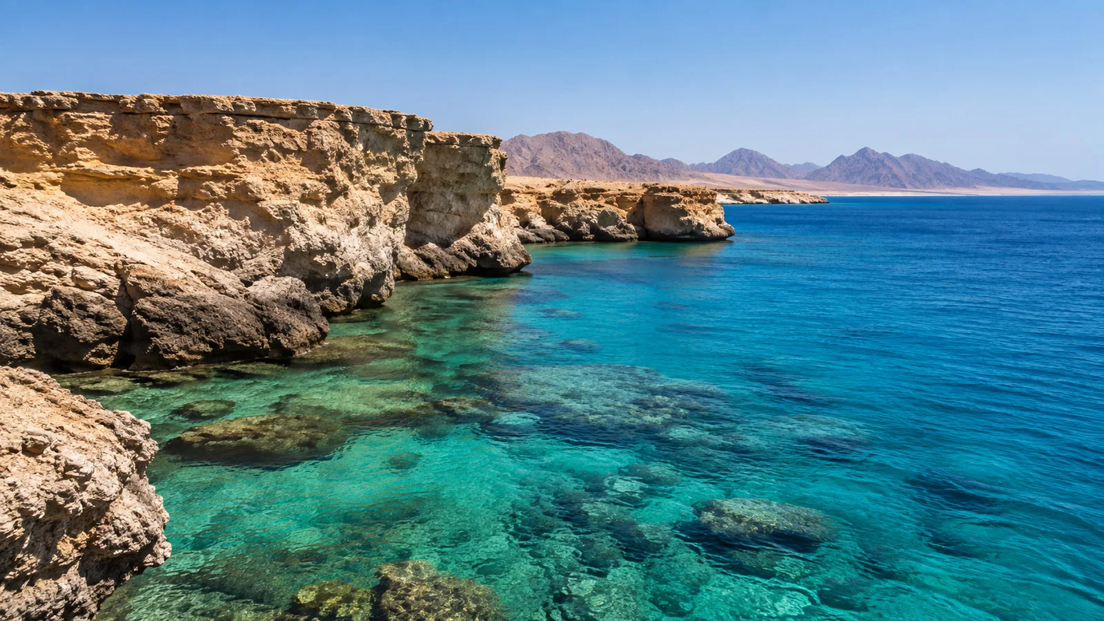 Turquoise Red Sea water and desert cliffs at Ras Mohammed National Park