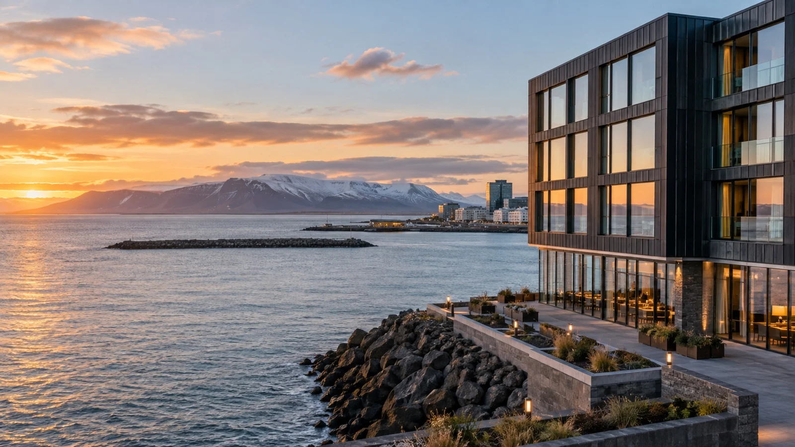 Upscale Reykjavík waterfront hotel exterior overlooking Faxaflói Bay with modern Icelandic design