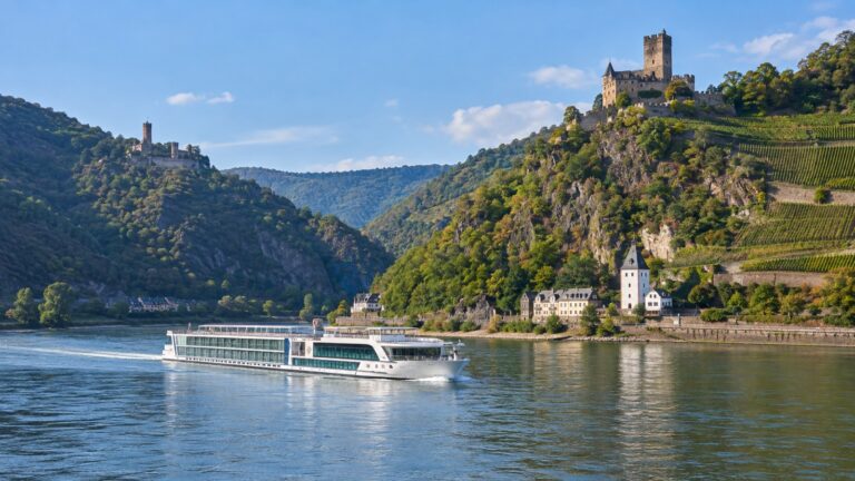 River cruise ship among castles in the Rhine Gorge