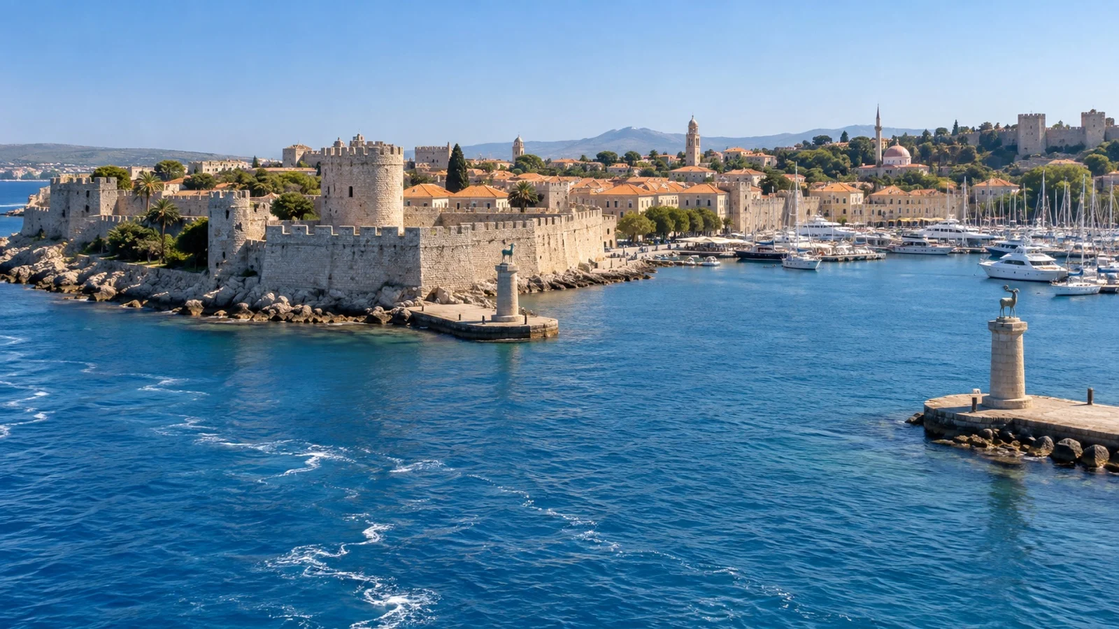 Rhodes old harbor and medieval walls seen from the water.