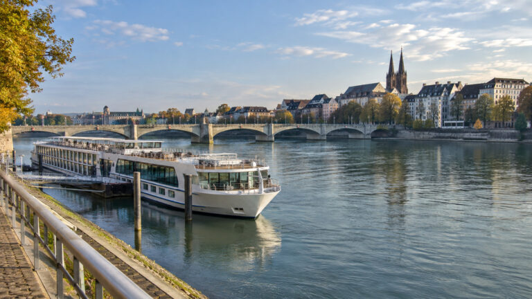 Basel Rhine river cruise berth with city bridge