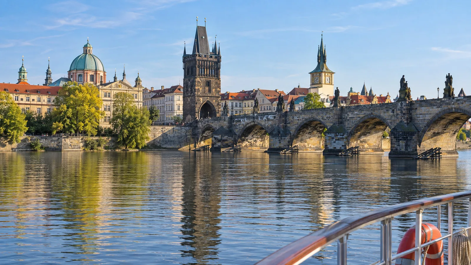 Prague's Charles Bridge and Old Town skyline in a single clear morning scene without people