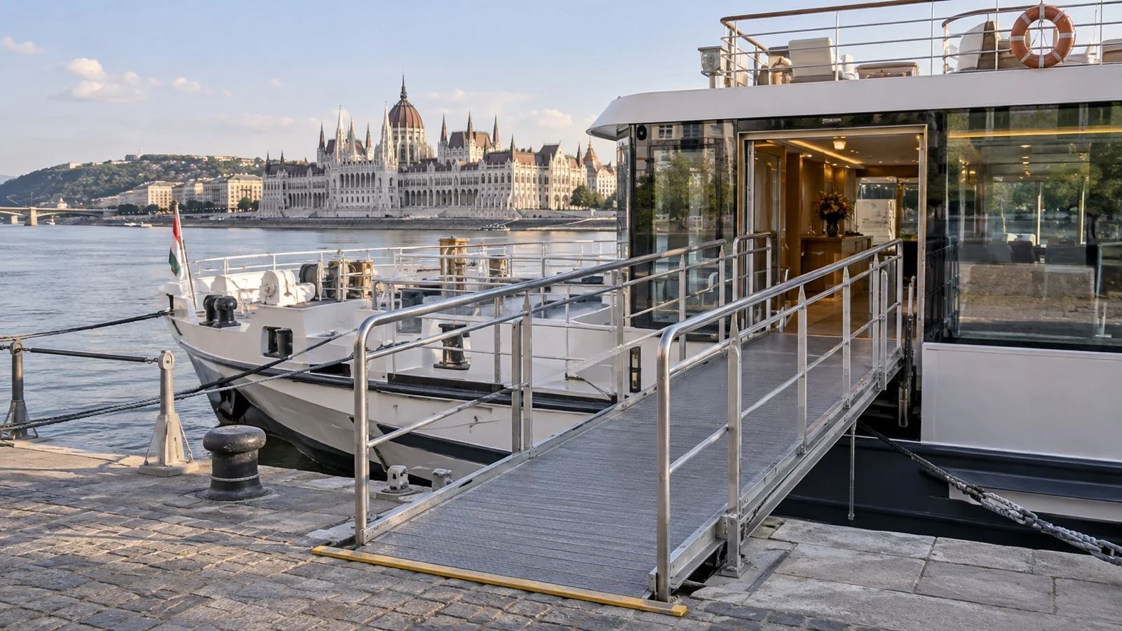 Empty gangway leading from a European river quay onto a river cruise ship