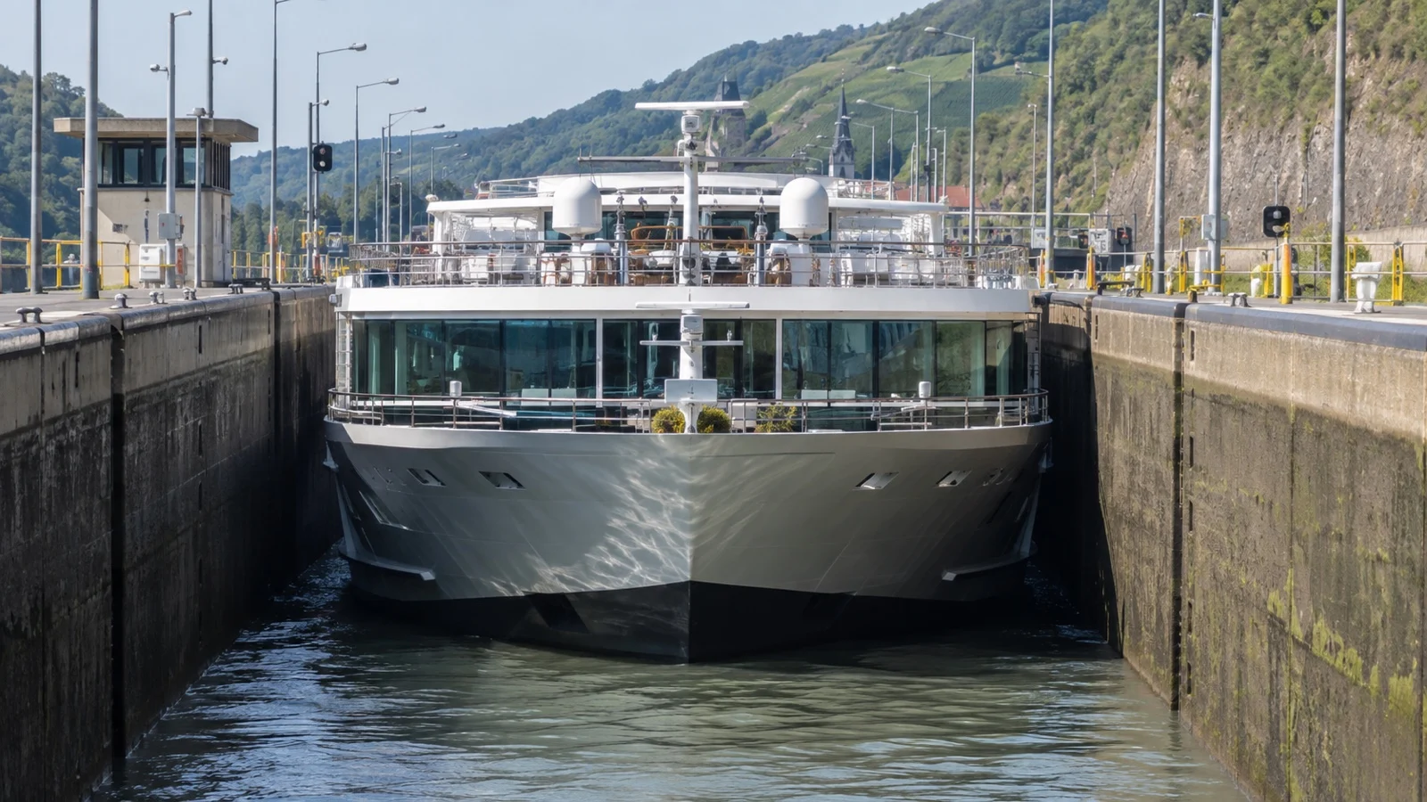 River cruise ship passing narrow European lock
