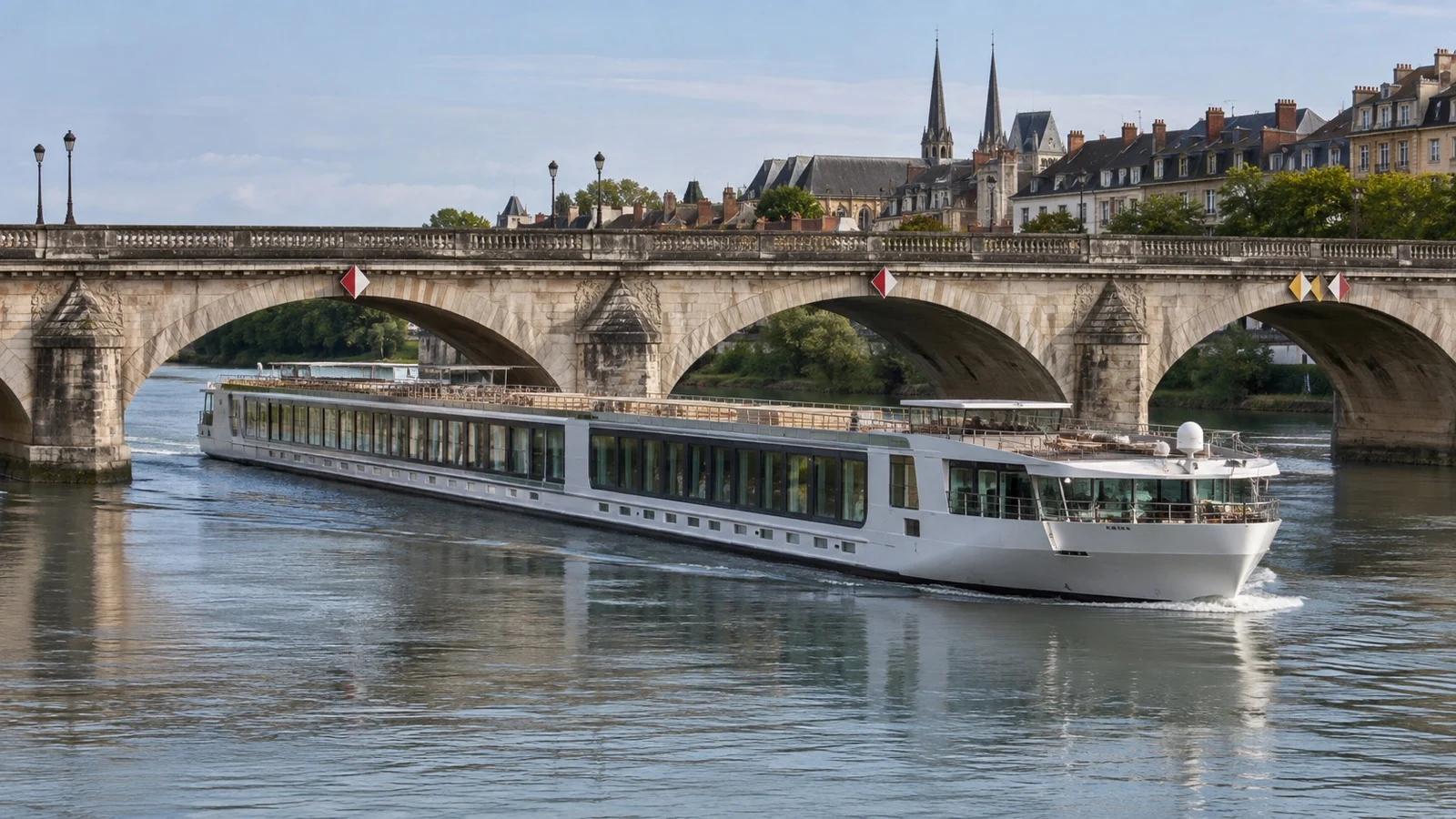 River cruise ship passing under low bridge