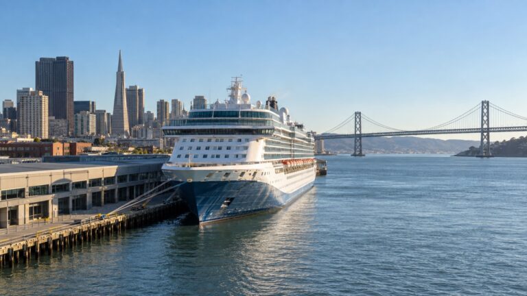 Cruise ship docked at Pier 27 on the San Francisco Embarcadero with Bay Bridge in distance