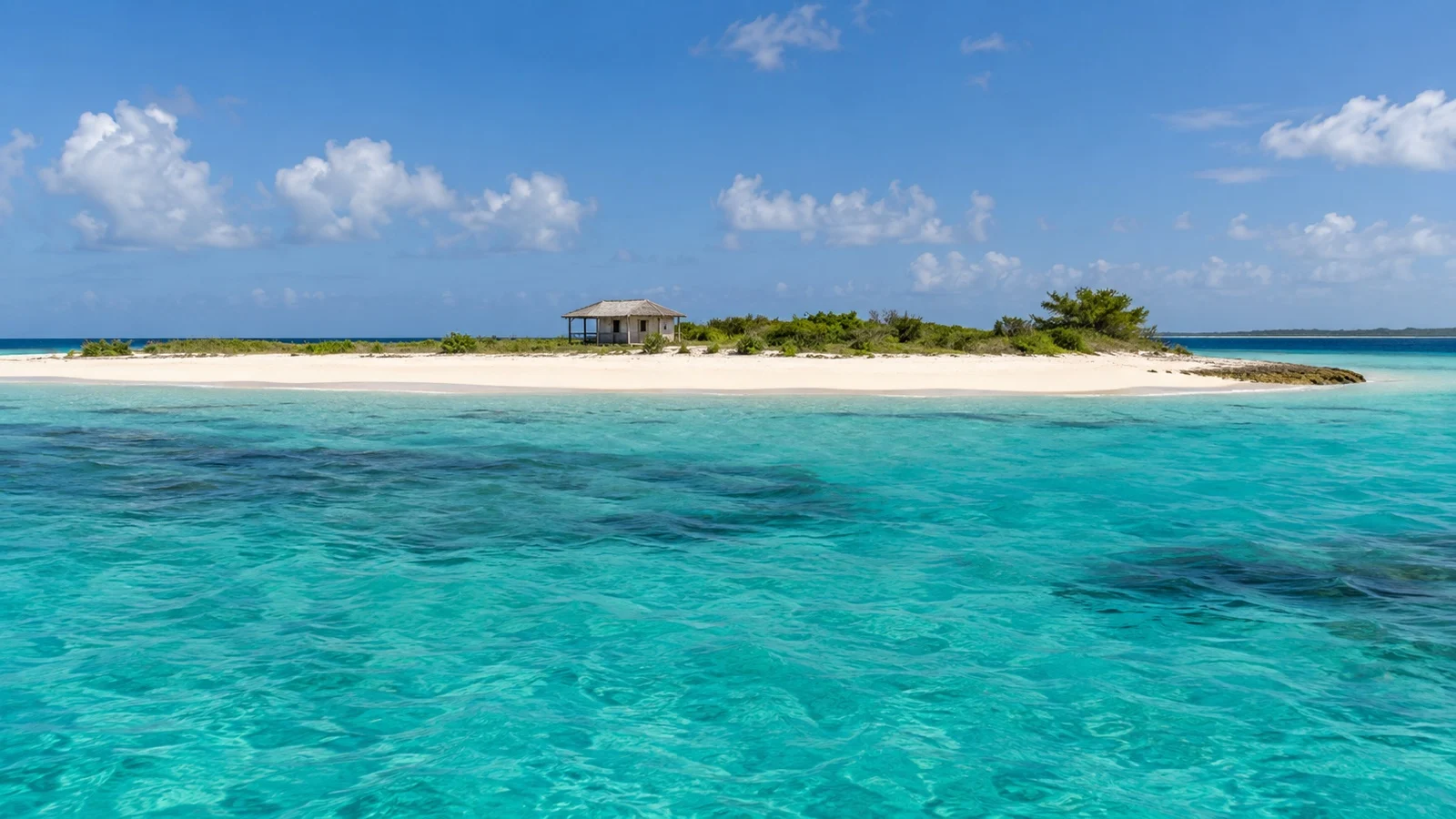Small sandy cay and turquoise shoals off the coast of Anguilla
