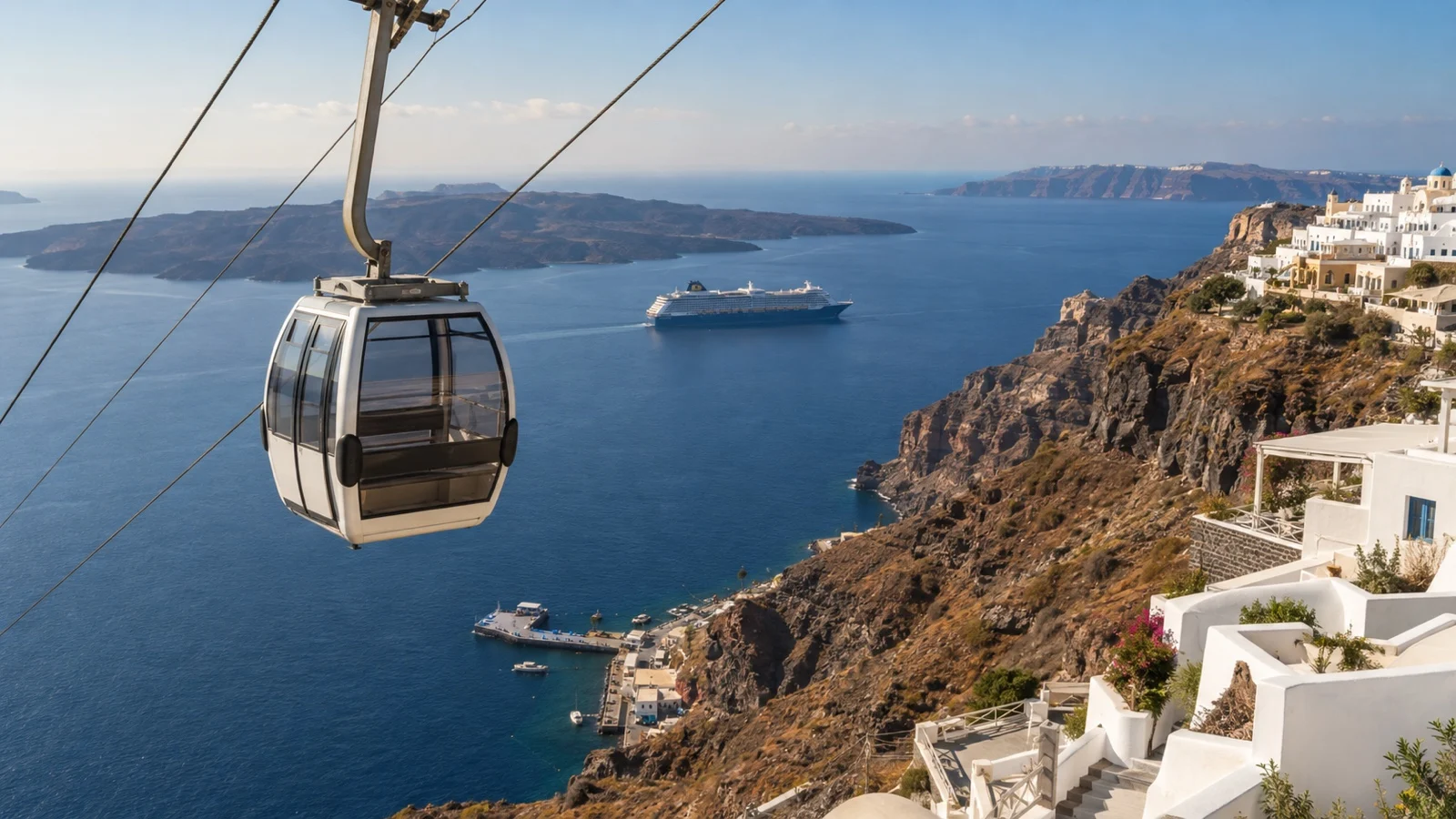 Empty cable car above Fira cliffs in Santorini with cruise ship offshore