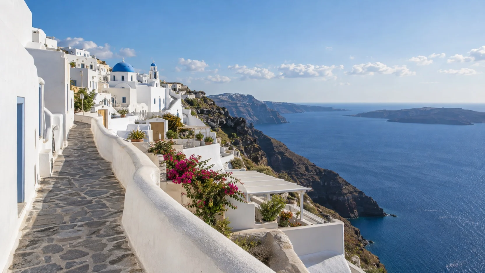 Empty whitewashed Fira lane above the Santorini caldera