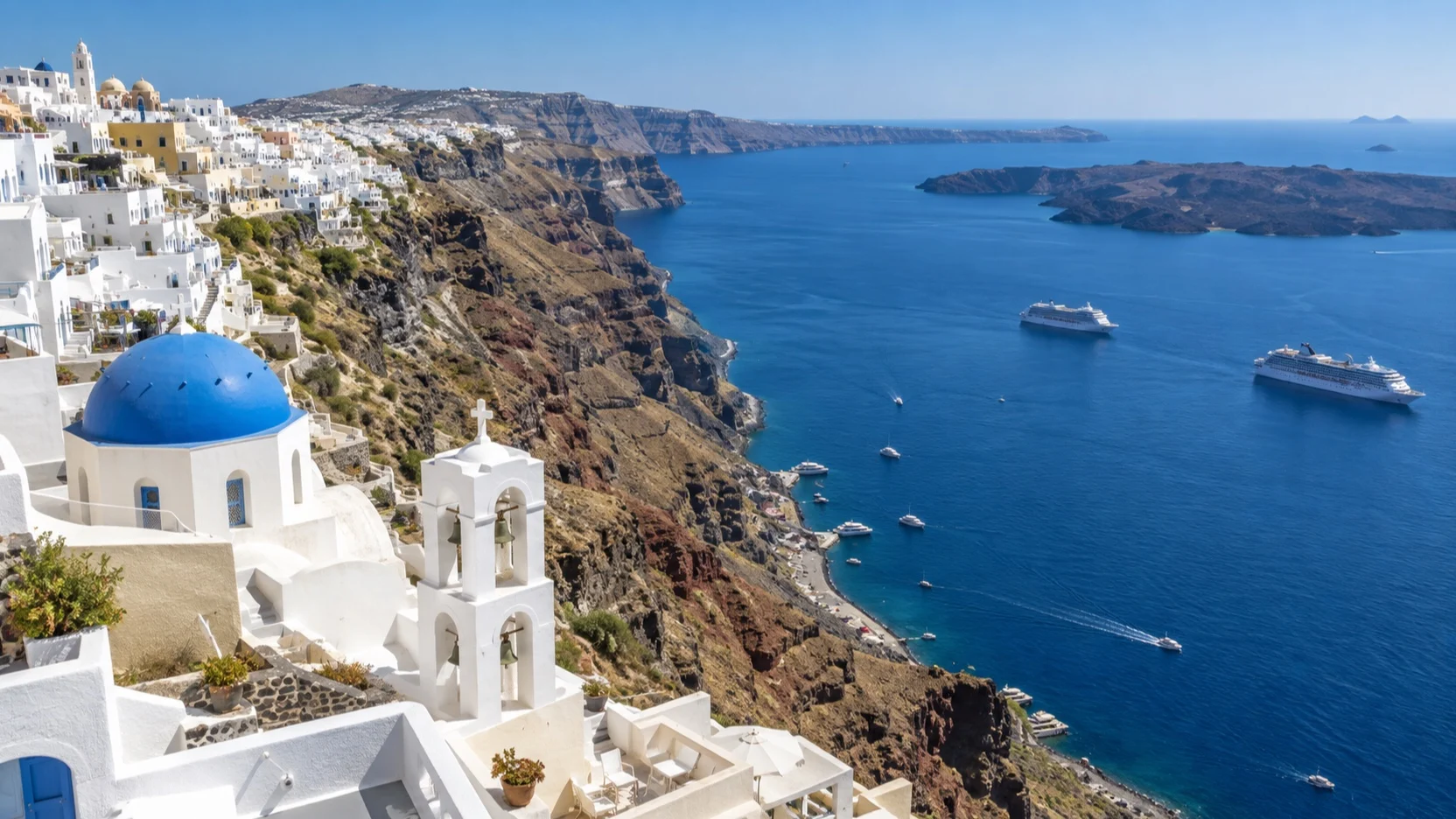 Santorini caldera cliffs and whitewashed Fira above cruise tenders