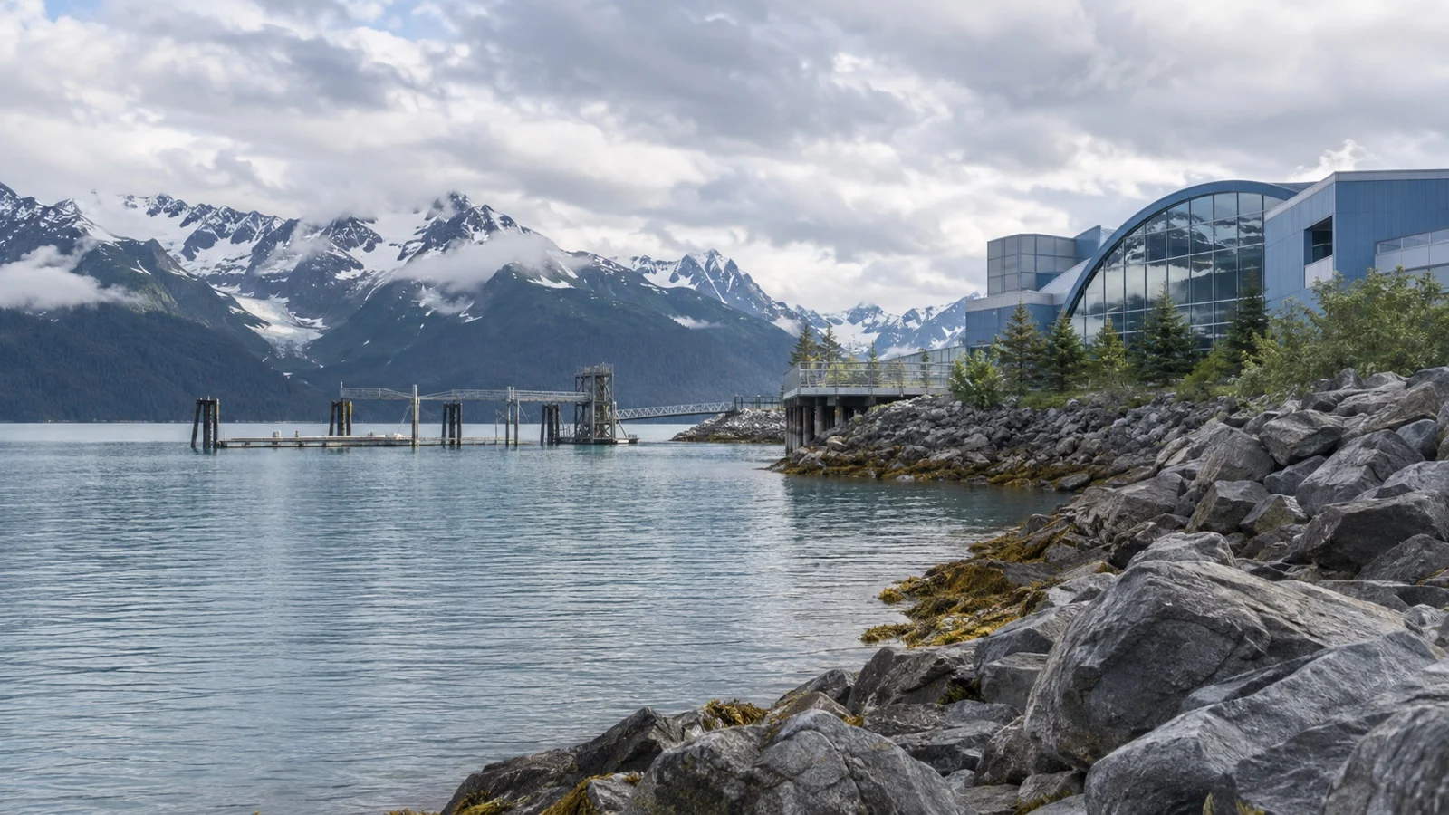 Modern waterfront building and mountain view beside Resurrection Bay