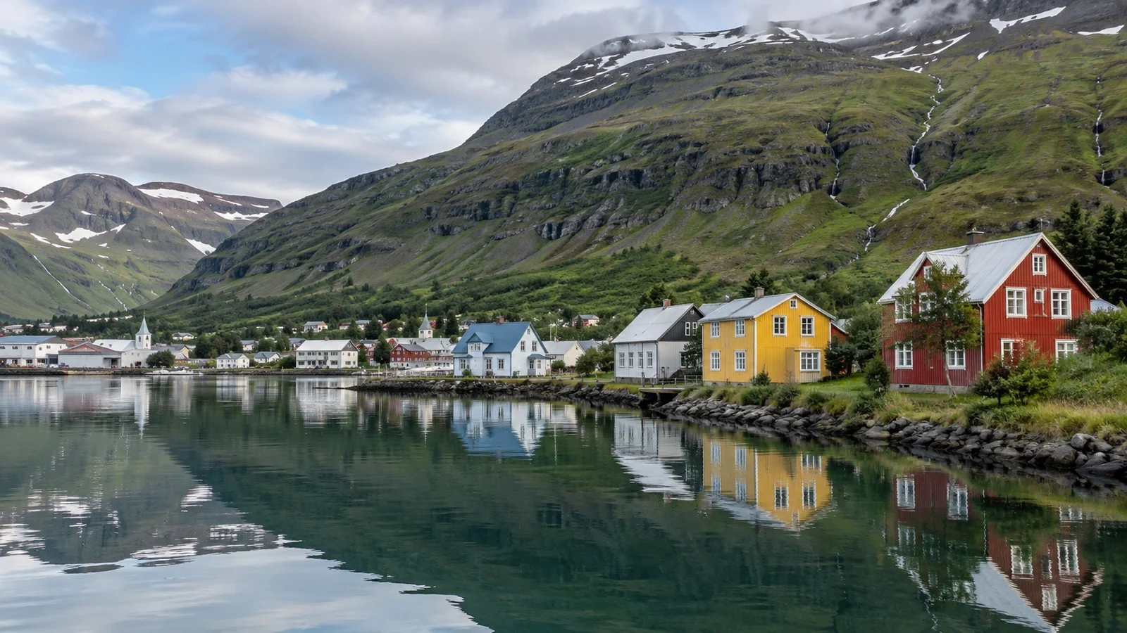 Colorful wooden village houses beside Seyðisfjörður fjord