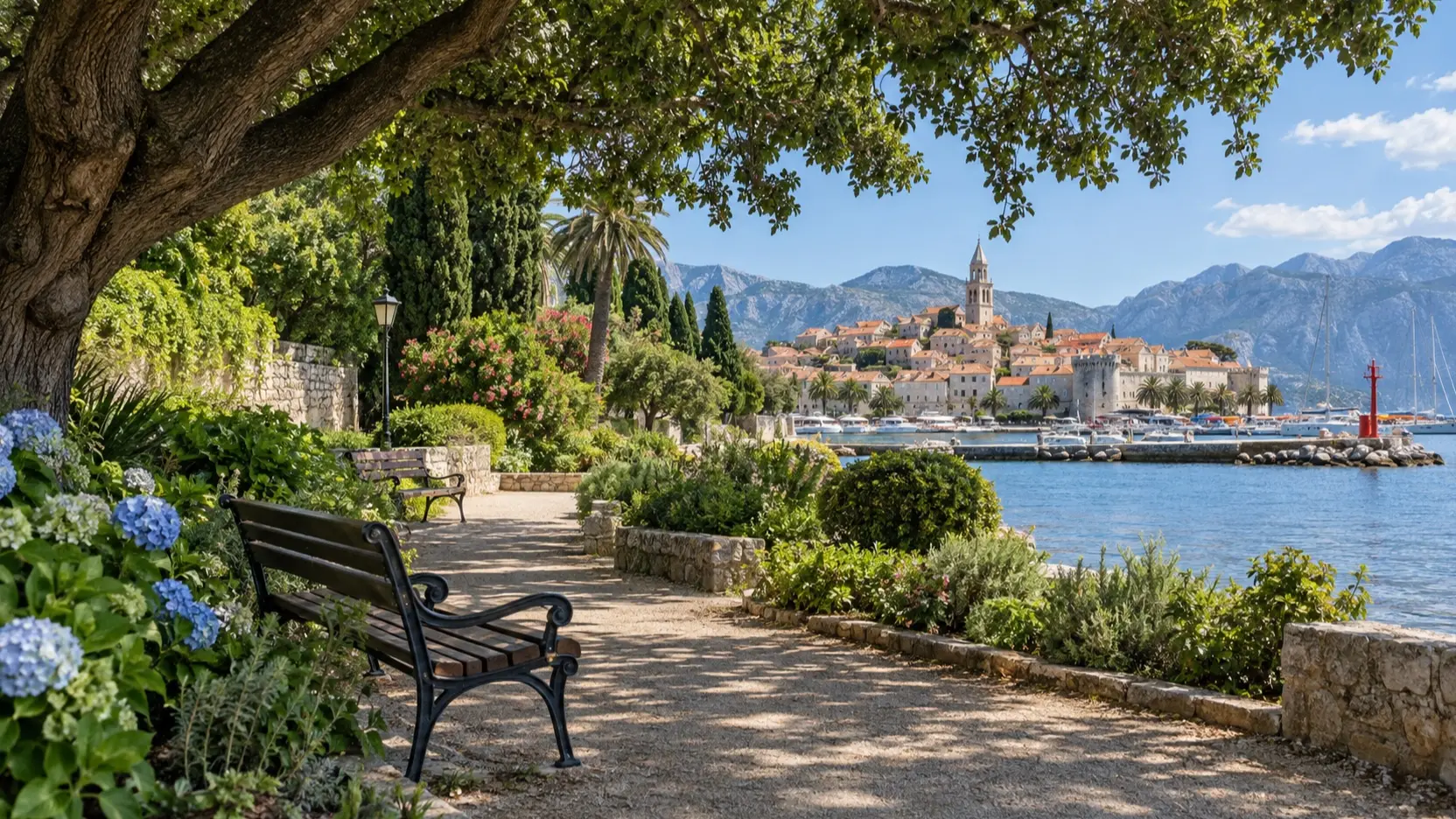 Shaded waterfront garden with benches near an old town