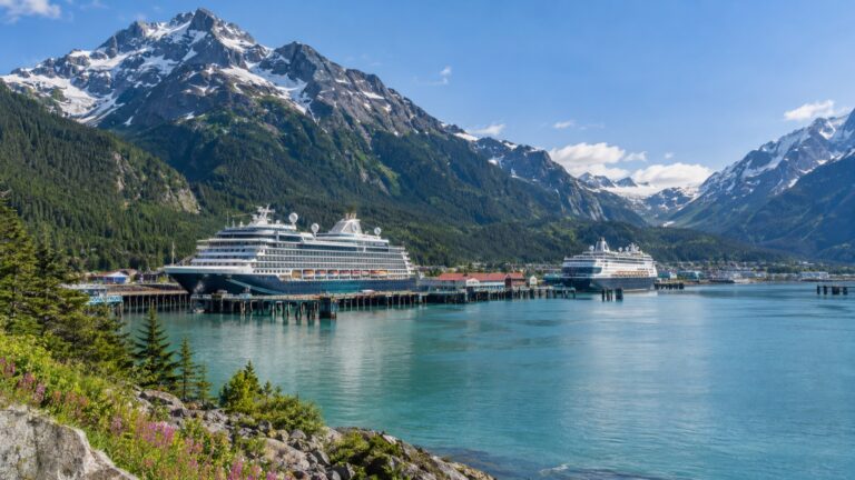 Cruise ships docked at Skagway beneath Alaska mountains