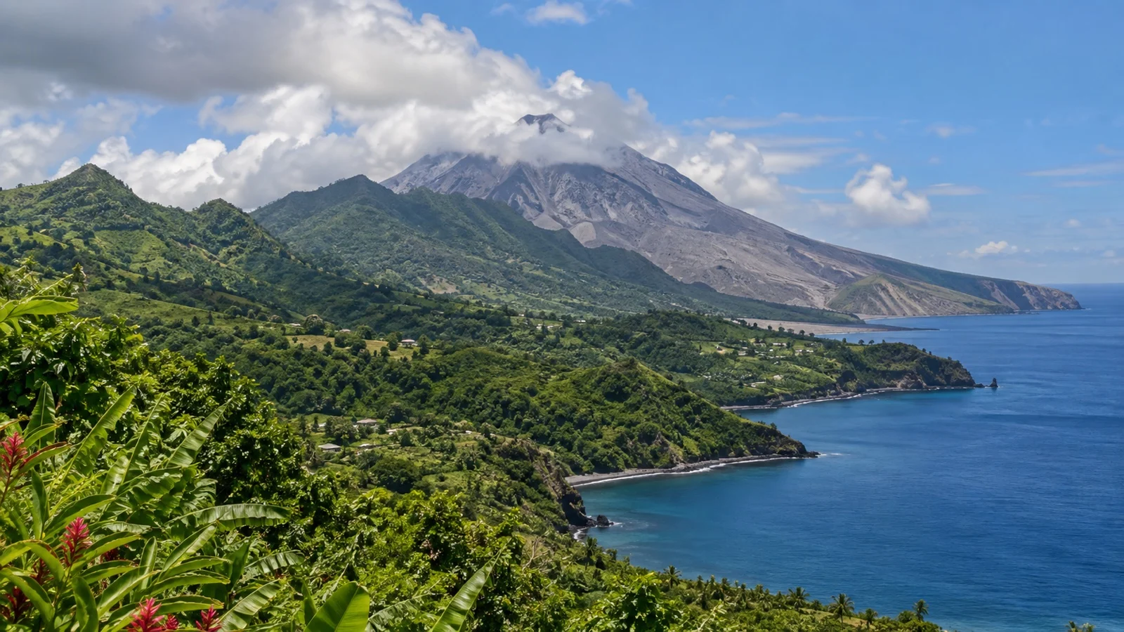 Soufrière Hills volcano rising above green northern Montserrat