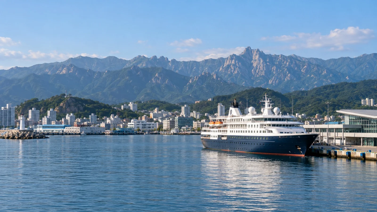 Cruise ship at Sokcho harbor with East Sea coast and Seoraksan mountains beyond