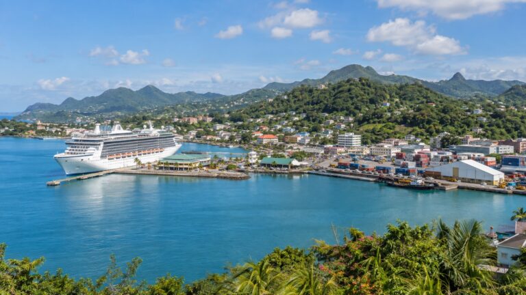 Cruise ship docked in Castries harbor below the green hills of Saint Lucia
